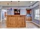 Basement bar with wood cabinetry and pendant lighting at 1924 Wilkenson Xing, Marietta, GA 30066