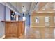 Basement bar with wood cabinetry and pendant lighting at 1924 Wilkenson Xing, Marietta, GA 30066