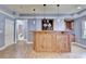 Basement bar with wood cabinetry and blue walls at 1924 Wilkenson Xing, Marietta, GA 30066