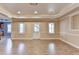 Finished basement featuring hardwood floors and multiple windows at 1924 Wilkenson Xing, Marietta, GA 30066