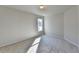 Well-lit bedroom with neutral walls and carpet, featuring a window with natural light at 1924 Wilkenson Xing, Marietta, GA 30066