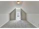 Bright attic bedroom with sloped ceilings and window at 1924 Wilkenson Xing, Marietta, GA 30066