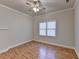 Bright bedroom featuring hardwood floors and a window at 1924 Wilkenson Xing, Marietta, GA 30066