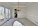 Dining room with chandelier and view into the kitchen at 1924 Wilkenson Xing, Marietta, GA 30066