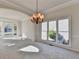 Spacious dining room with large windows and chandelier at 1924 Wilkenson Xing, Marietta, GA 30066