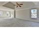 Large main bedroom with high ceilings, ceiling fan and carpet at 1924 Wilkenson Xing, Marietta, GA 30066