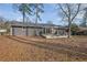 Backyard with a deck and pergola perfect for outdoor dining and relaxation at 3413 Canadian Way, Tucker, GA 30084