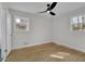 Large bedroom featuring wood floor, natural light, and modern ceiling fan at 3413 Canadian Way, Tucker, GA 30084