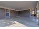 Carport featuring a painted floor and a secure entry door for easy access to the home at 3413 Canadian Way, Tucker, GA 30084