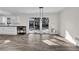 Dining area featuring sliding glass doors, a modern light fixture, and brand new flooring at 3413 Canadian Way, Tucker, GA 30084