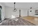 Dining area featuring sliding glass doors, a modern light fixture, and brand new flooring at 3413 Canadian Way, Tucker, GA 30084