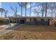 Charming single-story home featuring a covered carport, a long driveway and freshly painted exterior at 3413 Canadian Way, Tucker, GA 30084