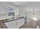 Eat in kitchen featuring a window over a double sink and stainless steel hardware at 3413 Canadian Way, Tucker, GA 30084