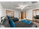 Basement bedroom with two twin beds and mirrored closets at 6045 Mockingbird Rd, Cumming, GA 30028