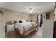 Primary bedroom with king bed and ceiling fan at 6045 Mockingbird Rd, Cumming, GA 30028