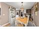 Bright dining area with white cabinets and hardwood floors at 6045 Mockingbird Rd, Cumming, GA 30028