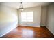 Bright bedroom featuring hardwood floors and a large window at 1351 Harbin Rd, Atlanta, GA 30311