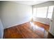 Spacious bedroom with hardwood floors and large windows at 1351 Harbin Rd, Atlanta, GA 30311