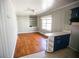 Small dining area with hardwood floors and built-in shelving at 1351 Harbin Rd, Atlanta, GA 30311