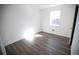 Bright bedroom with wood-look flooring and window at 2761 Rockdale, Decatur, GA 30034