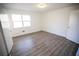 Bright bedroom with vinyl flooring and a large window at 2761 Rockdale, Decatur, GA 30034