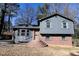 Two-story house with gray siding, brick base, and a small, landscaped yard at 2761 Rockdale, Decatur, GA 30034