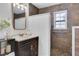 Updated bathroom with walk-in shower and dark brown tile at 390 Cascade Nw Dr, Marietta, GA 30064