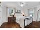 Cozy bedroom with a metal bed frame and wooden dresser at 390 Cascade Nw Dr, Marietta, GA 30064