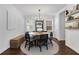 Charming dining room features a round table and chandelier at 390 Cascade Nw Dr, Marietta, GA 30064