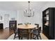 Elegant dining room with a round table and black cane chairs at 390 Cascade Nw Dr, Marietta, GA 30064