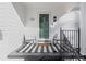 Inviting front porch with rocking chairs and stylish striped rug at 390 Cascade Nw Dr, Marietta, GA 30064