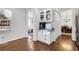 Kitchen features white cabinets and hardwood floors at 390 Cascade Nw Dr, Marietta, GA 30064