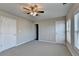 Bedroom with two closets and neutral walls at 4323 Tacoma Trce, Suwanee, GA 30024