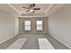 Bright bedroom with carpet, ceiling fan and double door closet at 4323 Tacoma Trce, Suwanee, GA 30024