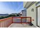 Deck with wooden railings, offering a view of the neighborhood at 4323 Tacoma Trce, Suwanee, GA 30024