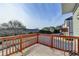 Private deck with wooden railings and community views at 4323 Tacoma Trce, Suwanee, GA 30024