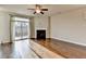 Living room features hardwood floors, fireplace and access to deck at 4323 Tacoma Trce, Suwanee, GA 30024