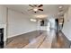 Hardwood floor living room with fireplace and open floor plan at 4323 Tacoma Trce, Suwanee, GA 30024