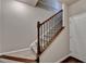 Elegant staircase with dark wood railing at 4323 Tacoma Trce, Suwanee, GA 30024