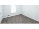 Spacious bedroom featuring gray carpet and a window at 476 Cody Ln, Douglasville, GA 30134