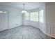 Dining area with gray tile floor and white wainscoting at 476 Cody Ln, Douglasville, GA 30134