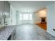 Bright dining area with gray tile floor and bay window at 476 Cody Ln, Douglasville, GA 30134