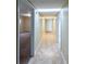 Long hallway with tile flooring leading to other rooms at 476 Cody Ln, Douglasville, GA 30134