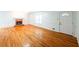 Bright living room featuring hardwood floors and a brick fireplace at 476 Cody Ln, Douglasville, GA 30134