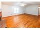 Hardwood floor living room with fireplace and vaulted ceiling at 476 Cody Ln, Douglasville, GA 30134