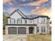 Two-story house with a gray double garage at 1411 Splitrock Sw Pl, Atlanta, GA 30331