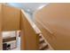 Carpeted staircase ascends with white trim against tan walls, leading to an upper level at 1411 Splitrock Sw Pl, Atlanta, GA 30331