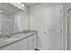 Bathroom with double vanity, granite countertops, and storage at 4336 Mallory Ct, Union City, GA 30291