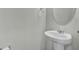 Simple bathroom with pedestal sink and oval mirror at 4336 Mallory Ct, Union City, GA 30291