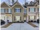 Modern townhouse exterior with neutral colors and a 2-car driveway at 4336 Mallory Ct, Union City, GA 30291